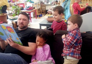 Dad reading to kids